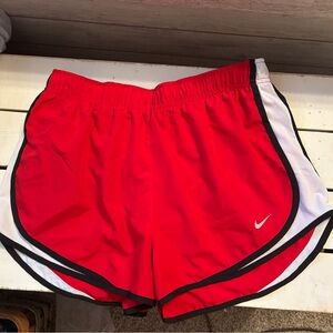 Women’s red Nike running shorts size L